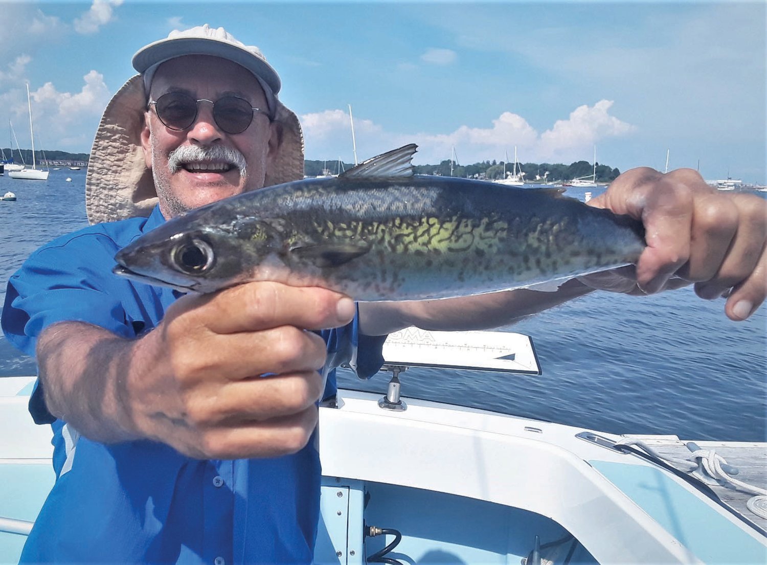  MACKEREL BITE: Kevin Fetzer with a cub mackerel he caught off Beavertail Light, Jamestown last year. These speedsters are fun to catch and eat. And this year they are larger, in the 20-inch range. (